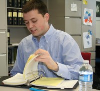 Andrew Buser, second-year law student, works at the Entrepreneurial Legal Services Clinic in between attending classes and studying.