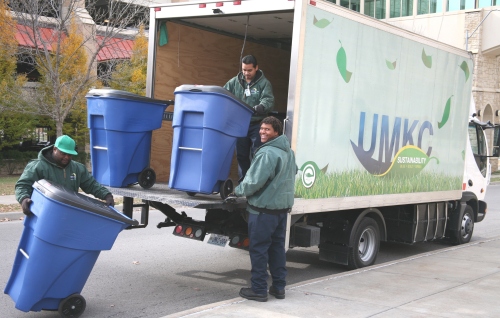 UMKC Campus Facilities staff use the university's eco-friendly all-electric truck to service the campus recycling program.