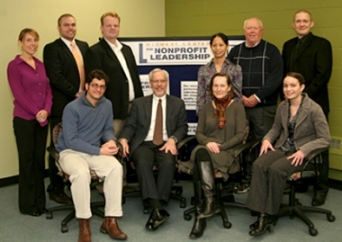 The staff of the Midwest Center for Nonprofit Leadership at UMKC. Standing, from left: Jessica Mattingly, Scott Helm, Mark Culver, Memcha Loitongbam (visiting Fulbright Scholar), Gary Baker, Fredrik Andersson; Seated, from left: Brent Never, David Renz, Cindy Laufer, Emma Spong