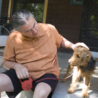 Professor Prue and family terrier, Lucy, spend a moment on the porch.