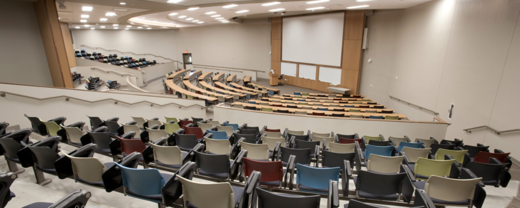 UMKC lecture hall in Miller Nichols Learning Center - fixed seating screen in front