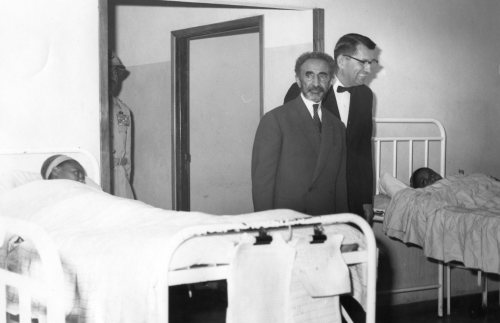 JoAnn Klaassen's father, Herb Ediger, with Ethiopian Emperor Haile Selassie (front), touring the leprosarium where Mr. Ediger served as administrator in the 1960s.