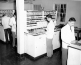 historical black and white photo of a School of Pharmacy lab