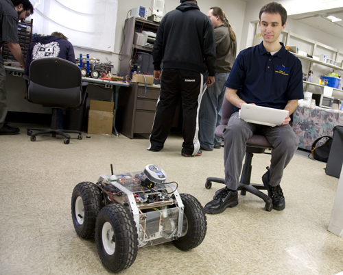 Jared Bayne test drives his robot in the robotics lab. Bayne, a 2009 SCE alumnus, credits Dilks with helping him obtain student leadership roles and become part of the U.S. Navy's Nuclear Propulsion Officer Candidate program.