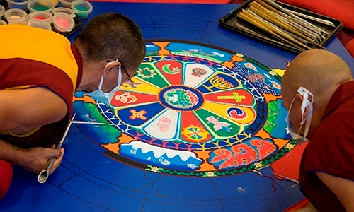 Tibetan monks from Drepung Gomang Monastic College in south India create a sand mandala, or Tibetan sand painting at UMKC's Katz Hall.