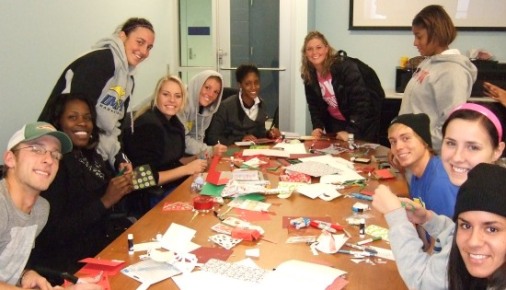 UMKC student-athletes create holiday cards for distribution to area hospitals and nursing homes.
