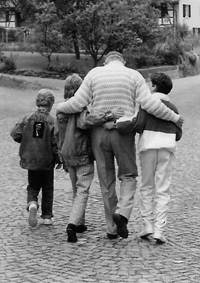 Connie Campbell says kids have always taken an instant liking to her husband, professor emeritus Warren Wheelock. Here, Wheelock and three boys from UMKC's Reading Clinic go for a walk.
