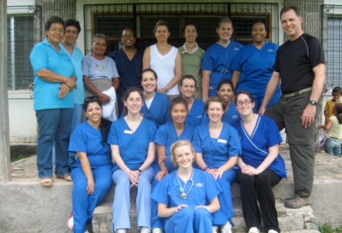 Thad Wilson (standing, far right) leads a group of nursing and pharmacy students and faculty to Honduras each summer to provide health care in rural areas.