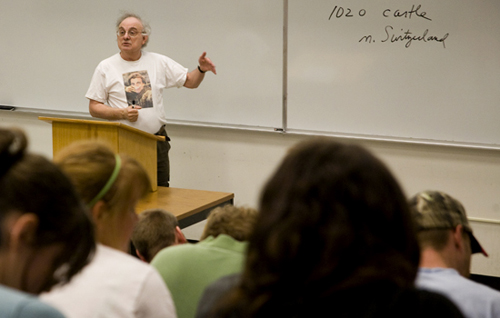 In Royall Hall 104, Professor Falls teaches students while wearing one of his history-related T-shirts.