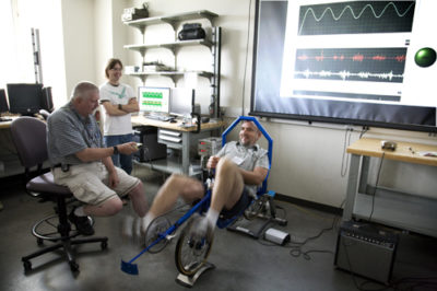Area high school teachers operate a human-powered vehicle in ARROWS' Mechanical Engineering module.