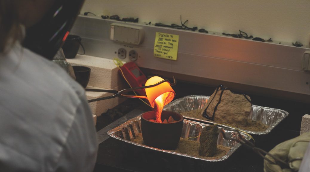 Photo of a student pouring lava in the lab