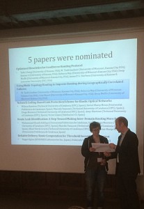 Becca May is presented with the Best Paper Award at the International Conference on Design of Reliable Communication Networks.