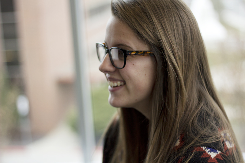 UMKC student Alex Dapp smiles in the Atterbury Student Success Center
